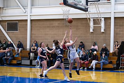 Landmark College women's basketball player makes a basket